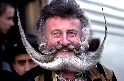 Gerhard Knapp of Germany, one of 80 delegates of the Association of German Beard Club, gets off the train in Reno