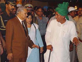 Haryana Governor Babu Parmanand and Chief Minister Om Prakash Chautala arrive at the state-level Haryana Day function in Kurukshetra