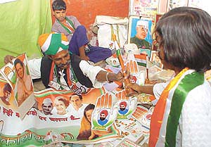 A girl buys a Congress flag outside the AICC office in the Capital