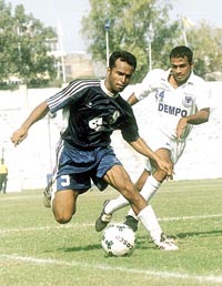 Players struggle to gain control of the ball during a Durand Cup encounter