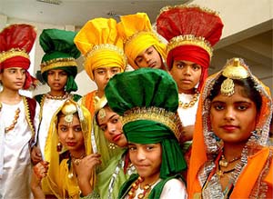 Students of various schools dressed in traditional Punjabi dresses at a function