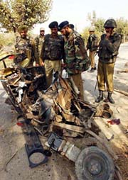 The wreckage of an auto-rickshaw used by militants to set off a blast