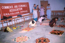 Students participate in the rangoli competition organised by the Commerce and Economics Association of GNN College