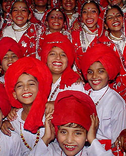 Students of the school pose excitedly before the start of the cultural programme