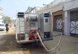 A fire engine supplies water at the house of a PCS officer in Ludhiana