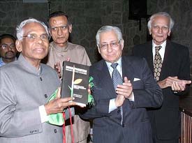 Former President K. R. Narayanan and Attorney General Soli Sorabjee release the book, "India-Pakistan: Themes Beyond Borders" while the author Mubashir Hasan of Pakistan looks on
