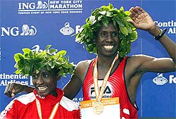 Margaret Okayo and Martin Lel from Kenya pose together on the winner's stand after winning their divisions of the New York City Marathon