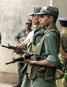 Sri Lankan troops guard the government press