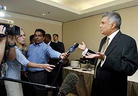 Sri Lanka's Prime Minister Ranil Wickremesinghe talks to the media