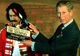 Prince Charles gives the clap ifor the "muhurat" shot of "The Rising"