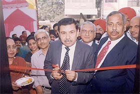 Mr Rohit Desai, Executive Director of Indian Overseas Bank, inaugurates an ATM at Fountain Chowk in Ludhiana