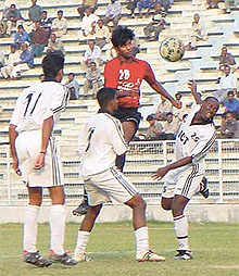 An aerial duel for the ball between the JCT and Mahindra payers 