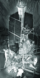 Stacked inside Gravity Probe B's insulated tank of liquid helium, seen between the solar panels in this photo, are four gyroscopes and a telescope that can peer through the top hatch
