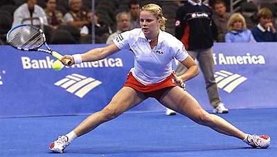 Kim Clijsters of Belgium returns a shot to Elena Dementieva of Russia