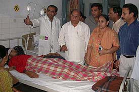 Chaudhary Jagjit Singh, Local Bodies Minister, Punjab, visits a dengue patient at the Civil Hospital
