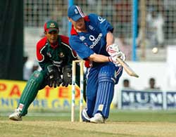 England's batsman Andrew Flintoff hits a ball to the boundary