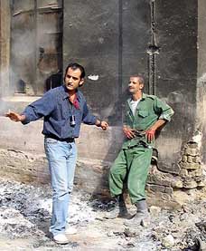Iraqi film director Oday Rasheed gives direction to an actor on the set of the country's first post-war feature film