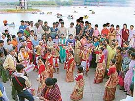 Participants of ongoing National Children Festival at Mohali present Bihu dance at Sukhna Lake in Chandigarh on Saturday.