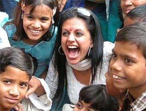 Television artist Mandira Bedi shares a light moment with children from SOS villages of India 