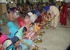 Devotees partake langar at a gurdwara in Ludhiana