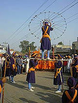 Members of the International Dasmesh Gatka Akhara perform gatka during nagar kirtan 