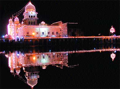 The reflection of the historical Bangla Sahib Gurdwara, specially illuminated for the birth anniversary of Guru Nanak Dev