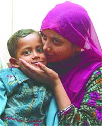 Tofiq Alam with his mother at a press conference 