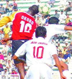 The players of East Bengal and Air-India during the second semi-final of the Durand Football Tournament at Ambedkar Stadium