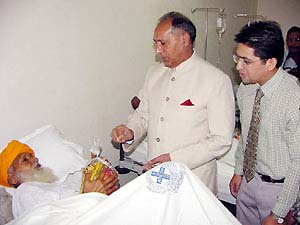 The Punjab Governor, Justice O.P. Verma, has a word with a patient after inaugurating a charitable cancer hospital at Muktsar