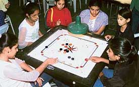 Junior girls participate in the third Saupins Inter-School Carrom Tournament