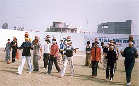 Students participate in chatti race at the school on Sunday