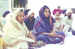 Delhi Chief Minister Sheila Dikshit listening to the Gurbani Shabad recital, organised at her residence in the Capital on Sunday.