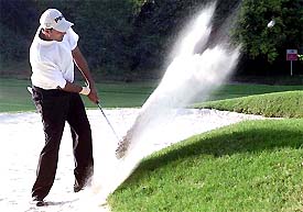 Arjun Atwal hits a stroke during the Hero Honda Masters Golf tournament