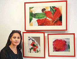 Madhu Pandit with her work at Fragrance of Eternity photo exhibition at Alliance Francaise in Sector 36, Chandigarh, on Tuesday.
