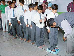 Karate players being weighed on the eve of the UT Inter-School Karate Meet at St. Josephs Senior Secondary School, Sector 44, Chandigarh, on Tuesday.