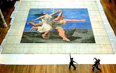 Two dancers rehearse in front of the stage curtain measuring 10.3m x 11.7m, worlds largest signed Picasso canvas