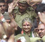 Delhi Chief Minister Sheila Dikshit waves to the public after filing her nomination at Patiala House in New Delhi