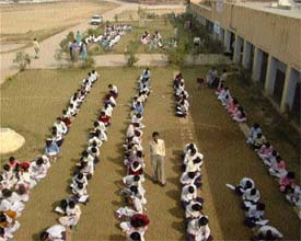 Children participating in an on-the-spot painting competition, organised by Restoring Force
