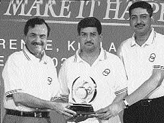Mr Deepak Joshi (centre), Managing Director, Joshi Autozone, and Mr Vikram Joshi (R) receive the Maruti Award for Excellence in Sales and Service at a dealers convention in Malaysia.