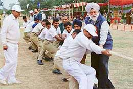 The Deputy Speaker, Punjab, Mr Bir Devinder Singh, joins ITBP men in a tug-of-war after inaugurating the forces