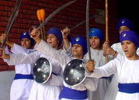 A girls team performs gatka during an inter-school cultural contest organised at Ramgarhia Girls Senior Secondary School