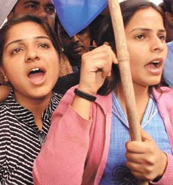 Activists of NSUI protesting against Union Minister of State for Environment Dilip Singh Judeo in front of the AICC office in the Capital