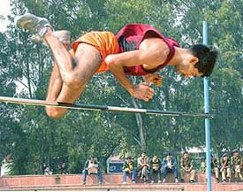 A trooper clears the bar during the high jump competition on the second day of the Indo-Tibetan Border Police Forces 23rd inter-sector athletics meet in Chandigarh on Tuesday.