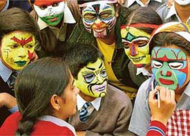 Students take part in a face-painting competition held at Central State Library in Chandigarh on Tuesday.