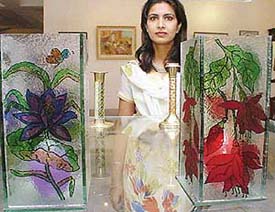 Raman Grewal poses with her delicately painted glass works, which are on display at Art Folio, Sector 9
