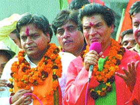 Noted actor Asrani making a point for Ashok Aggarwal, BJP candidate from Model Town for the Assembly election in the Capital