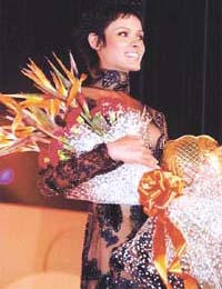 Sharan Mishra holding a bouquet