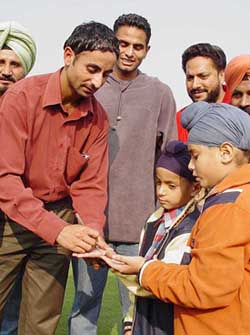 Indian Hockey stars Prabhjot Singh and Kawalpreet Singh oblige young  autograph hunters at a function in Amritsar 