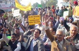 Members of the Punjab Chandigarh College Teachers Union protest outside the residence of the Minister for Higher Education, Mr Harnam Dass Johar