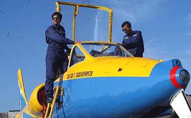 A lady pilot and partner check their  aircraft on the eve of Air Race India 2003 in Bangalore 